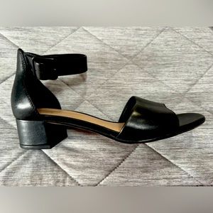 Black leather low square heel Clarks sandals.
